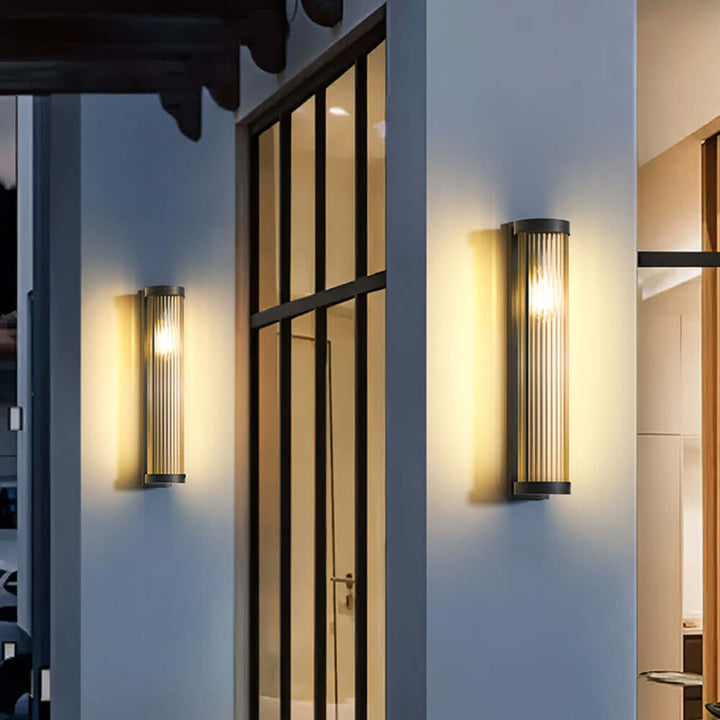 Sleek cylindrical solar pathway light. Durable metal & glass design for modern outdoor garden lighting.