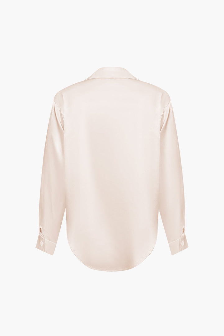 Classic women's button-down long-sleeve blouse, suitable for formal wear.