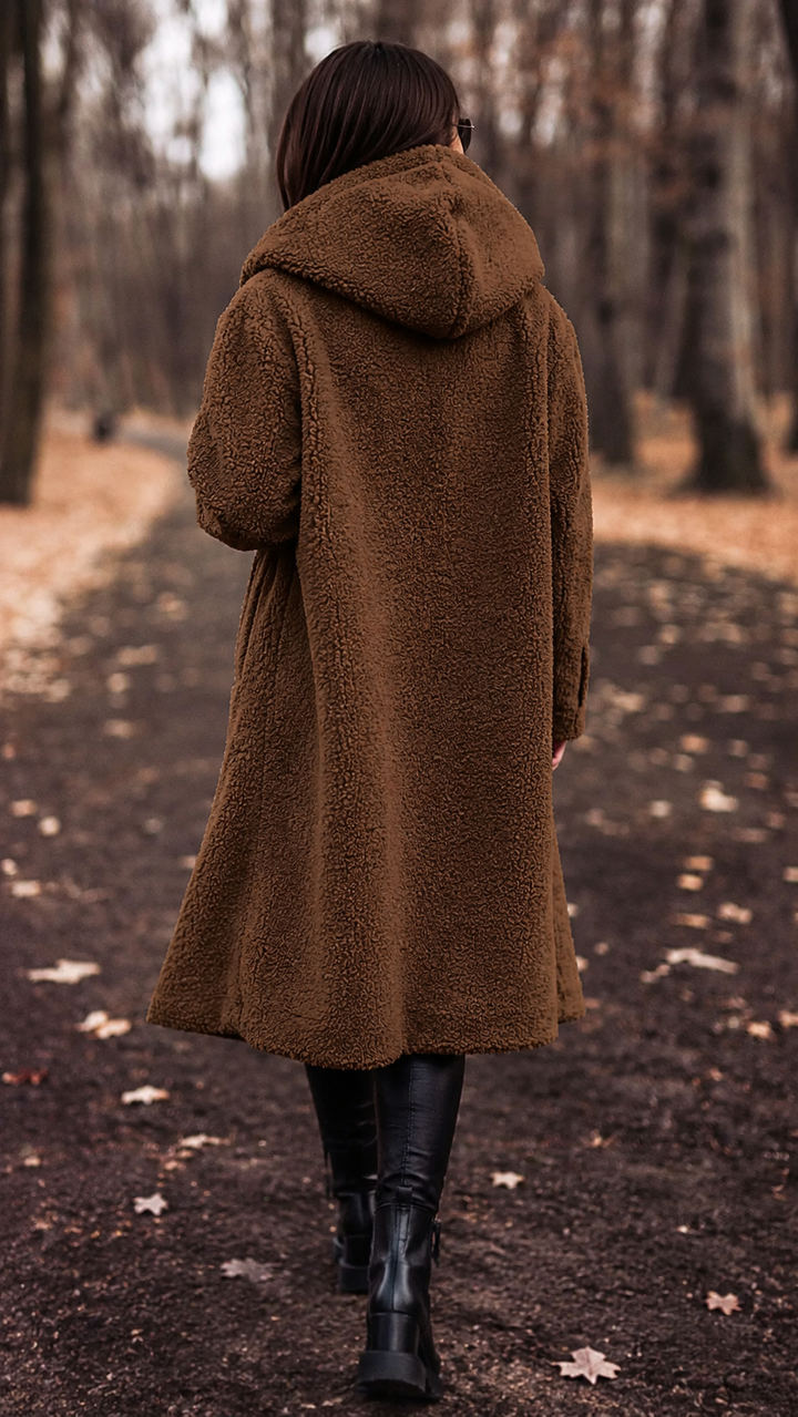 Stylish women's hooded knee-length coat, designed for ultimate warmth and chic winter fashion.