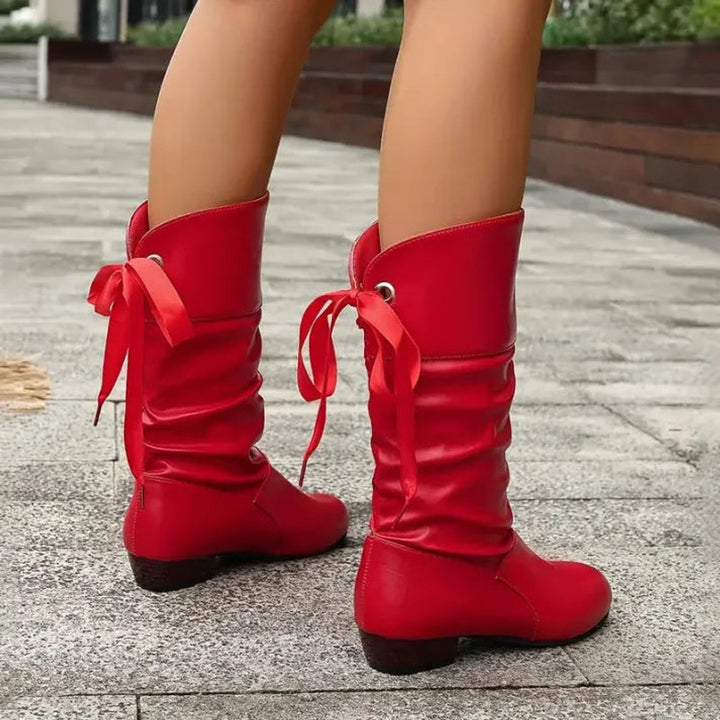 Versatile women's lace-up slouchy ankle boots with a block heel. Perfect for various casual & fashionable outfits.
