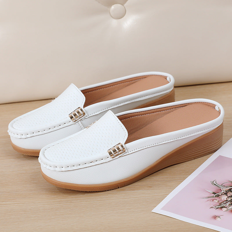 Women's stylish wedge mules, comfortable slip-on footwear with a perforated design.