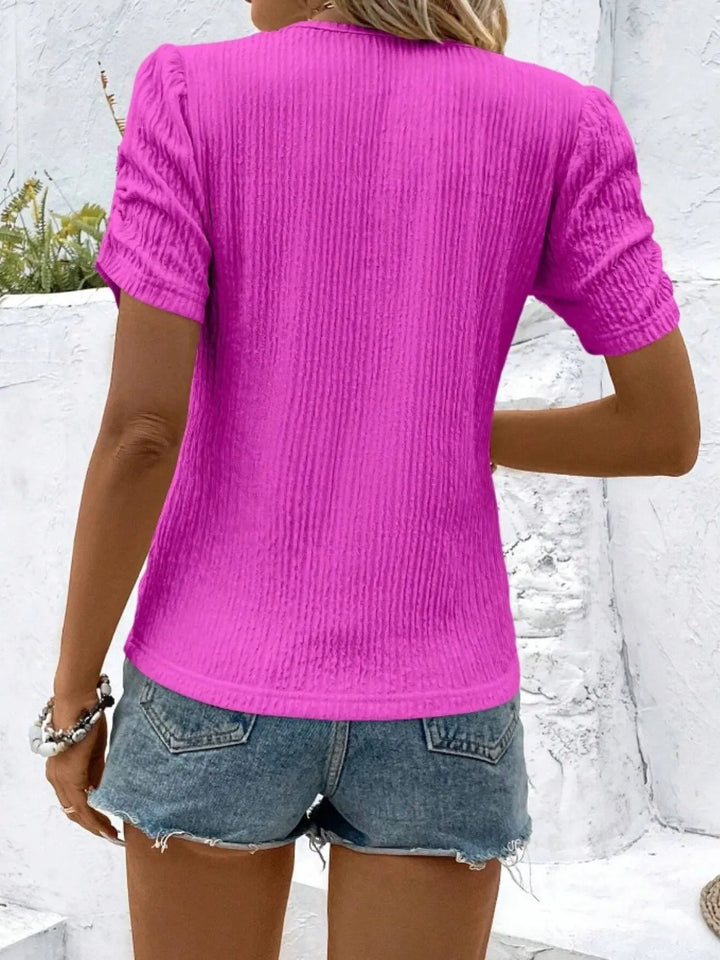 High-quality women's ruched short sleeve top. A fitted knit blouse designed for effortless style and comfort.
