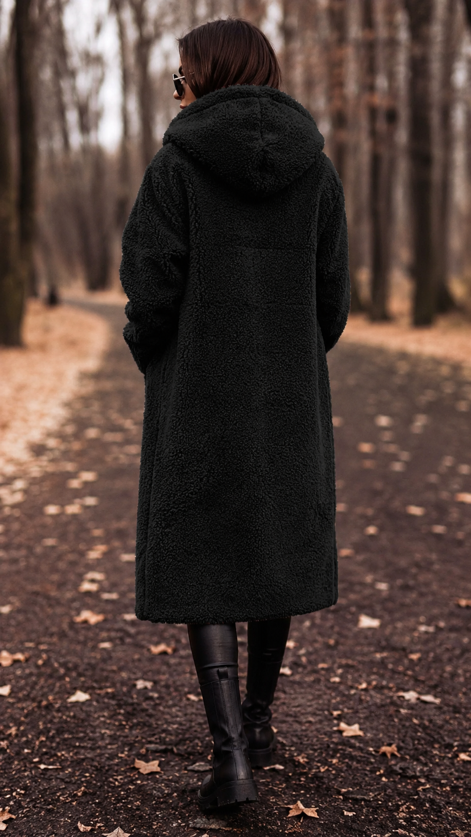 Women's elegant hooded winter coat, long and cozy, essential for stylish cold-weather layering.
