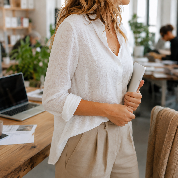 Effortless women's long sleeve button-down top, a stylish collared blouse for office, casual, and versatile apparel.