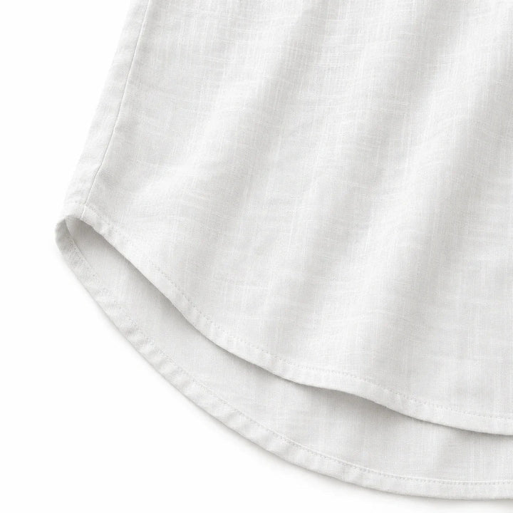 Versatile women's solid tank, sleeveless with V-neck & button-up front, relaxed fit.