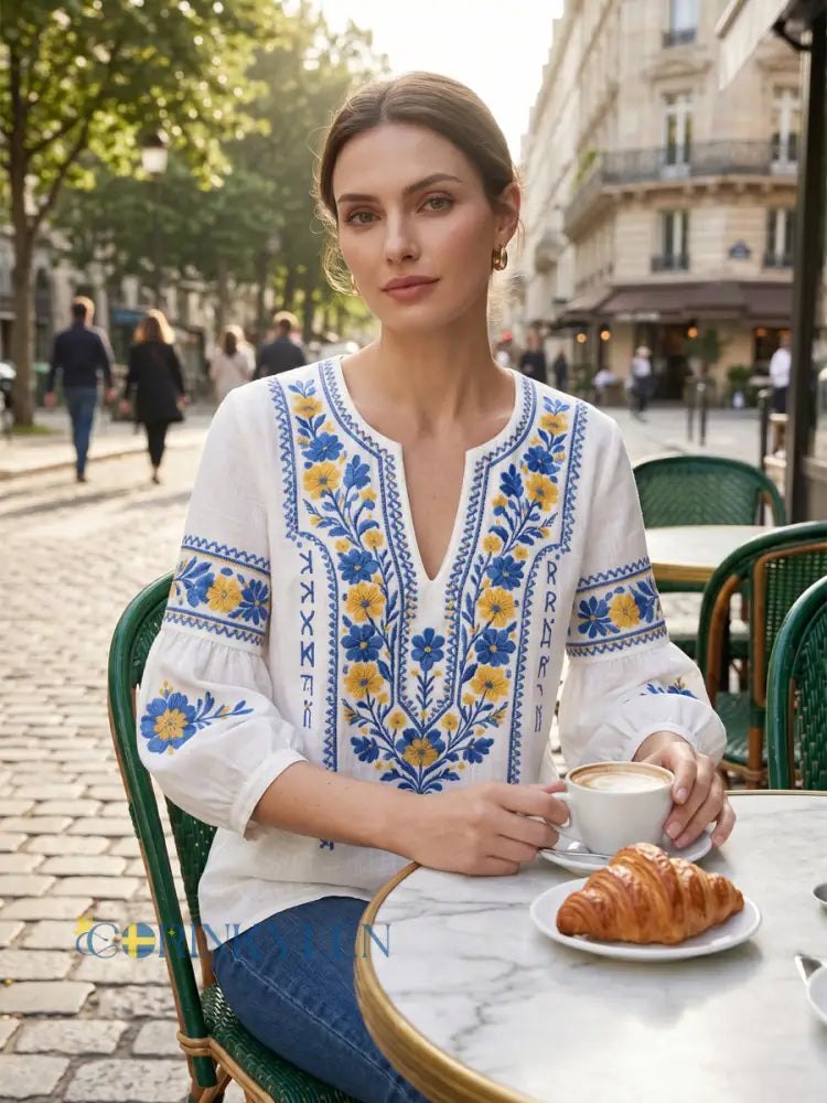 Elegant women's long sleeve V-neck blouse featuring detailed embroidery, ideal for spring and casual wear.