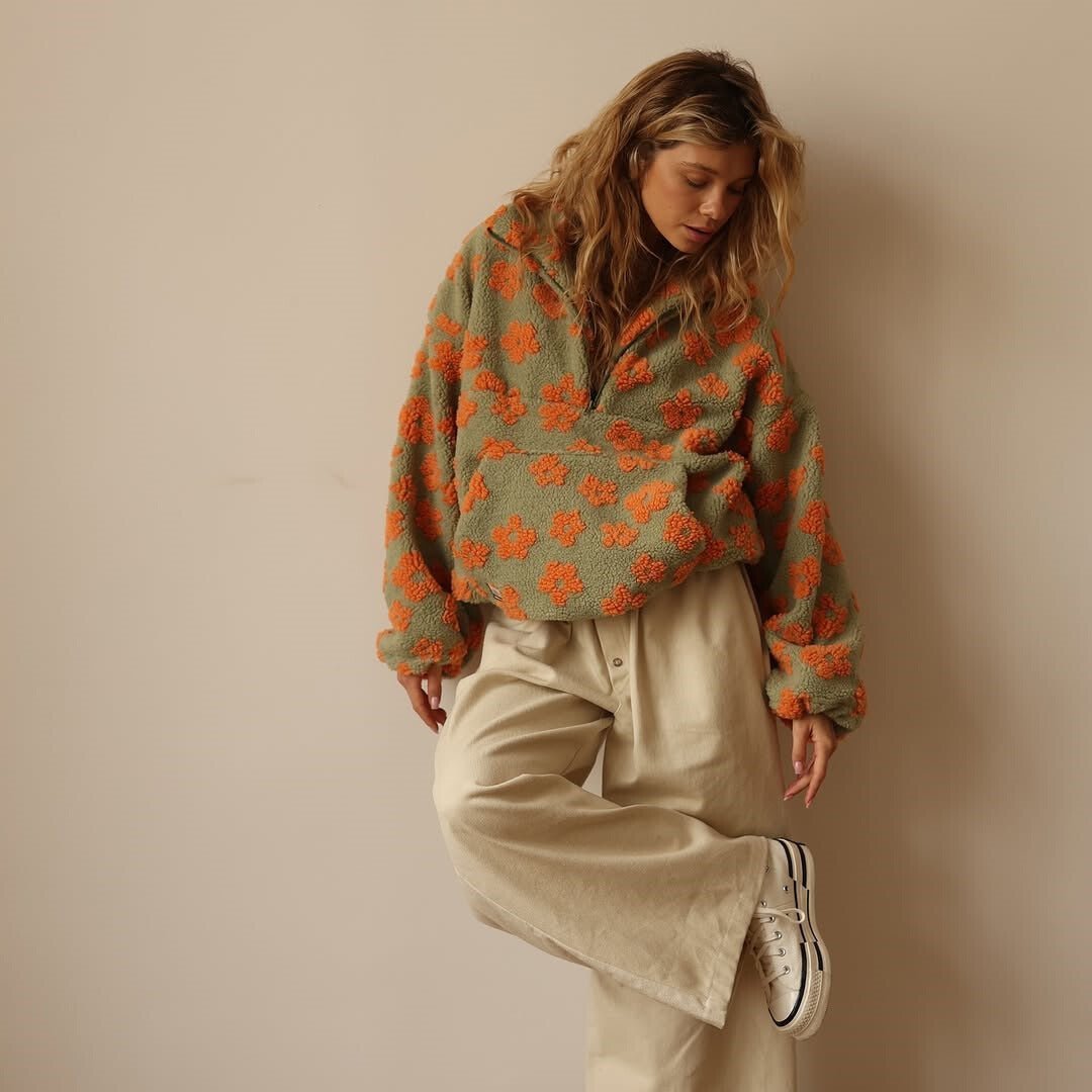 Women's warm oversized floral teddy fleece sweater with a half-zip design. Cozy and casual.