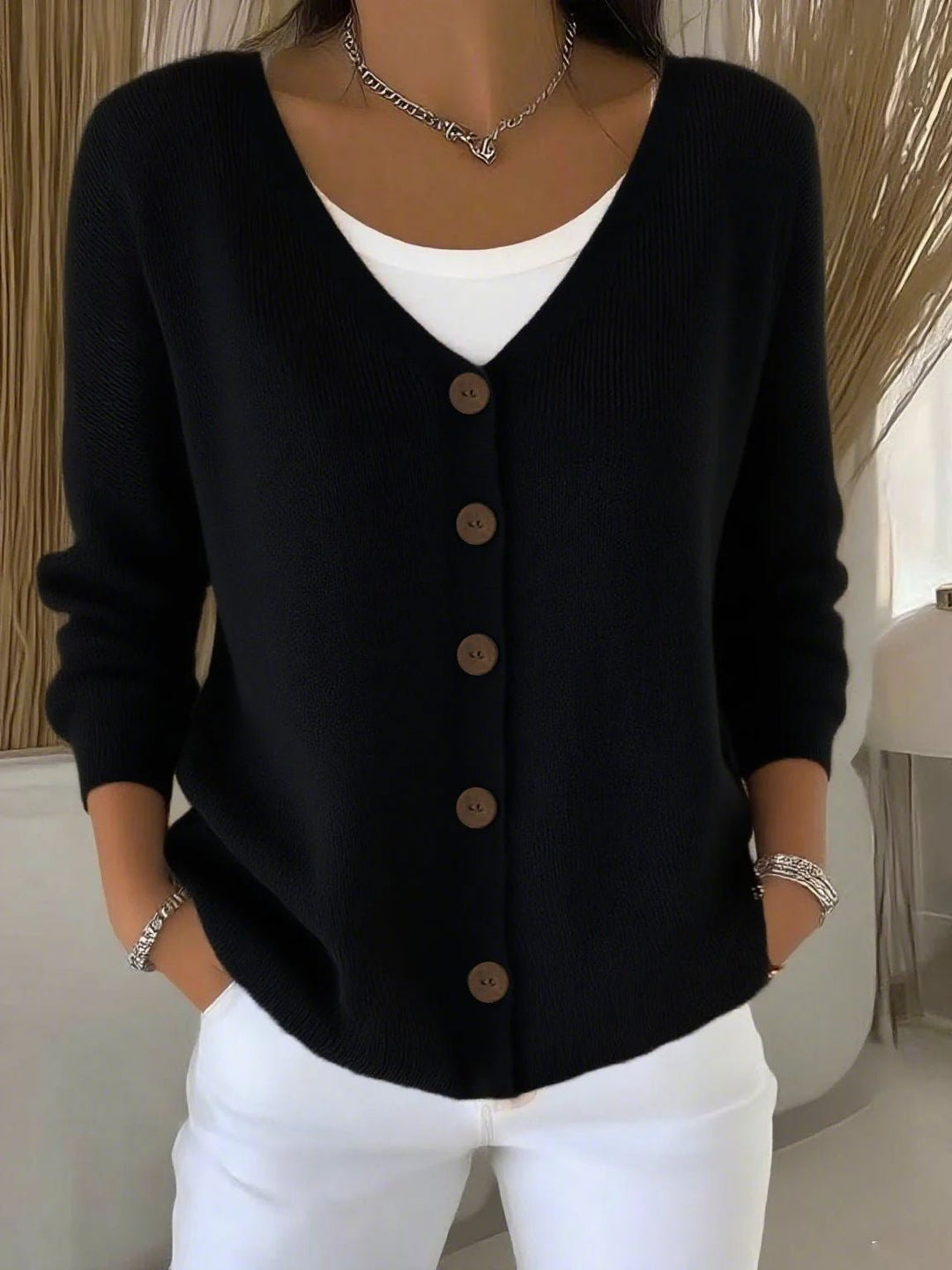Stylish women's V-neck button knit sweater. A versatile long sleeve cardigan for everyday elegant fashion.