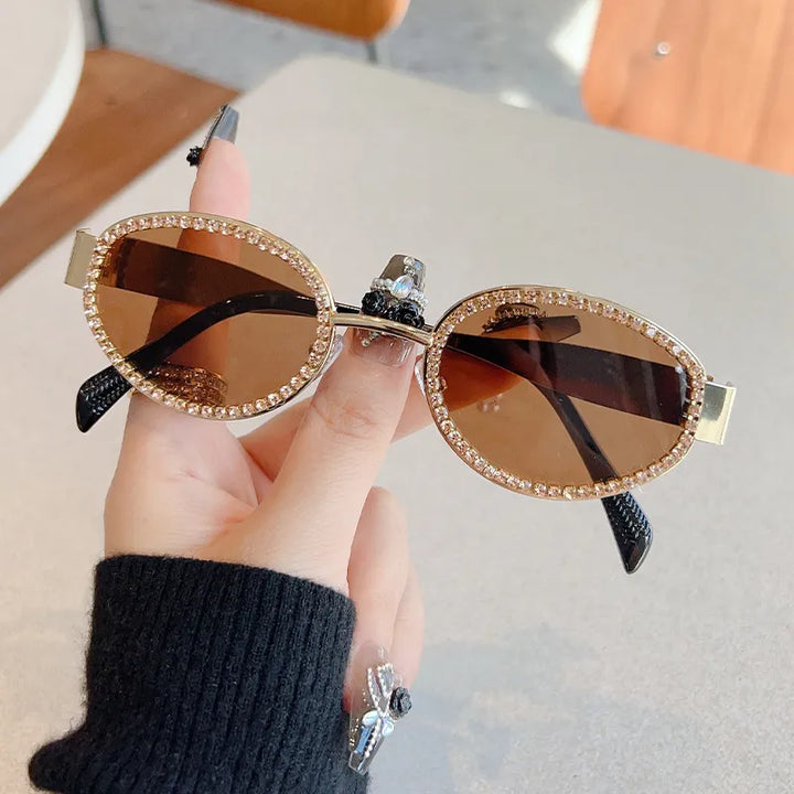 Chic women's round sunglasses with modern metal frame, a trendy fashion accessory for summer style.