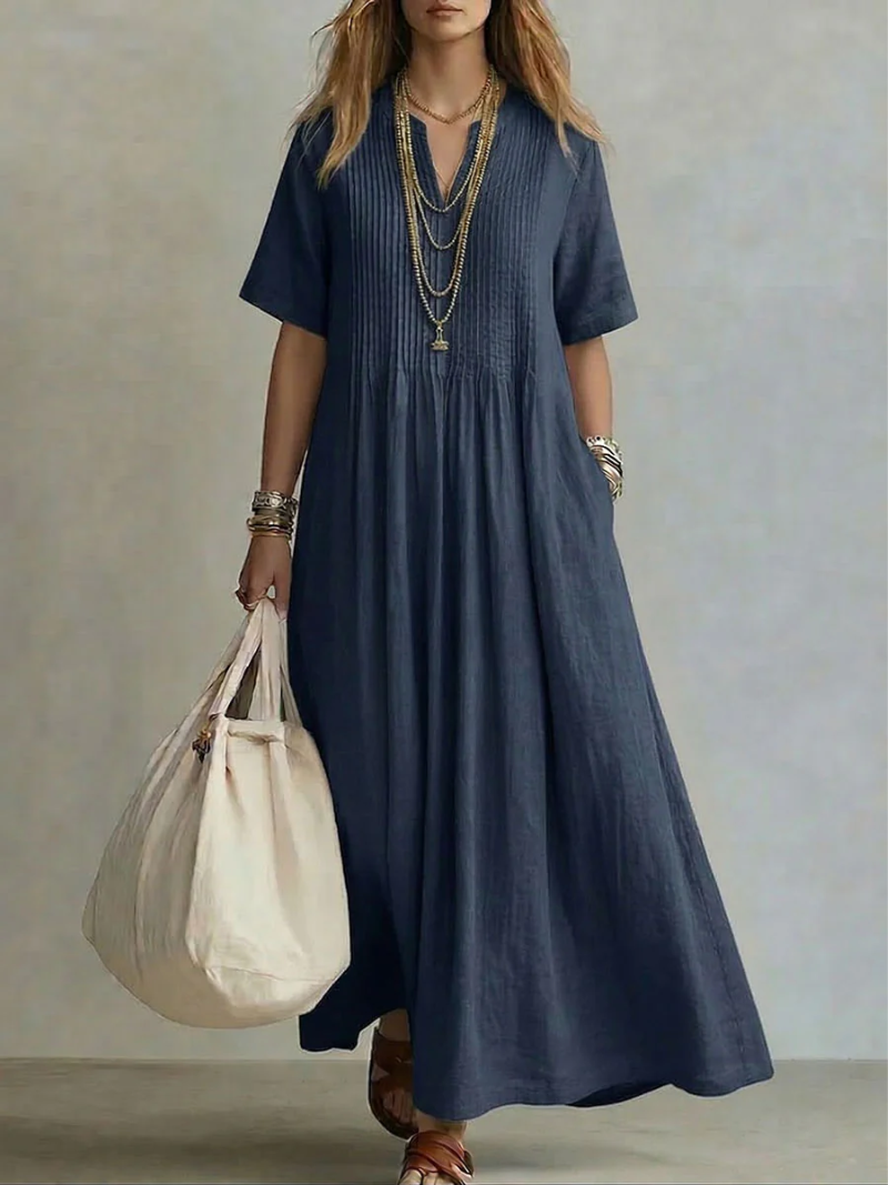 Women's V-neck short sleeve pleated maxi dress, offering a relaxed yet elegant silhouette for any occasion.