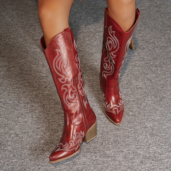 Rugged sole of women's wide-calf cowboy boots, with a robust block heel for outdoor wear.