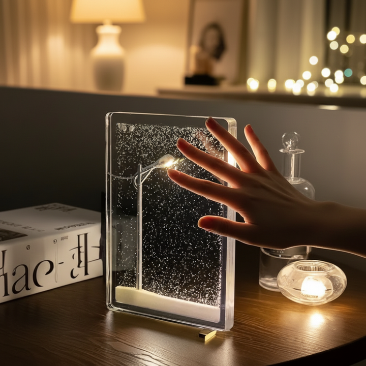 Decorative LED snowfall lamp creating a serene winter ambiance. Perfect for home decor, festive lighting, or a unique gift.