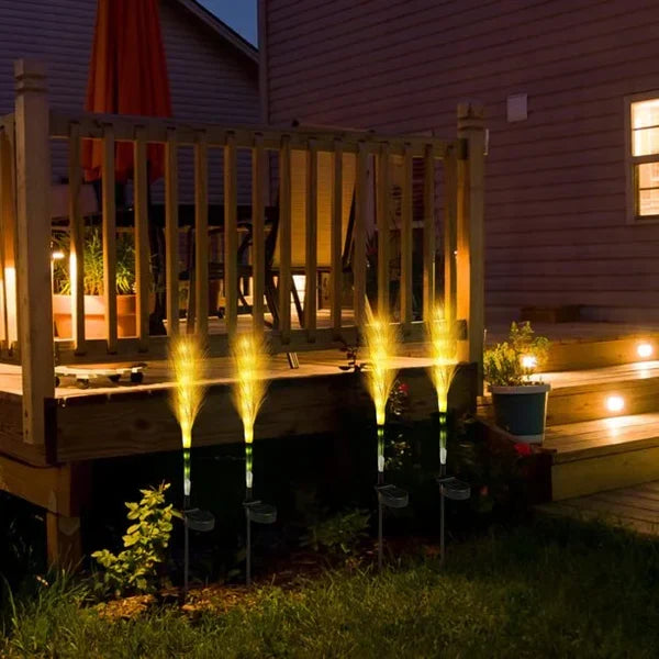 Stylish reed-style accent lights defining garden paths and borders with charm.