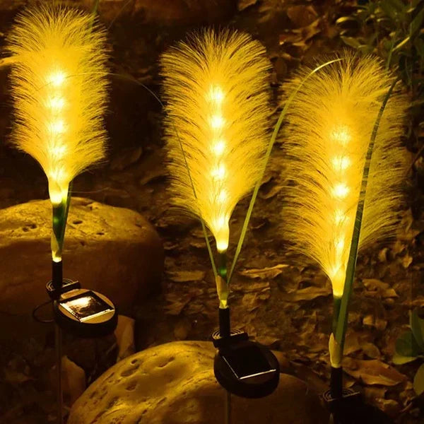 Artistic reed-style garden lights casting beautiful patterns for landscape lighting.