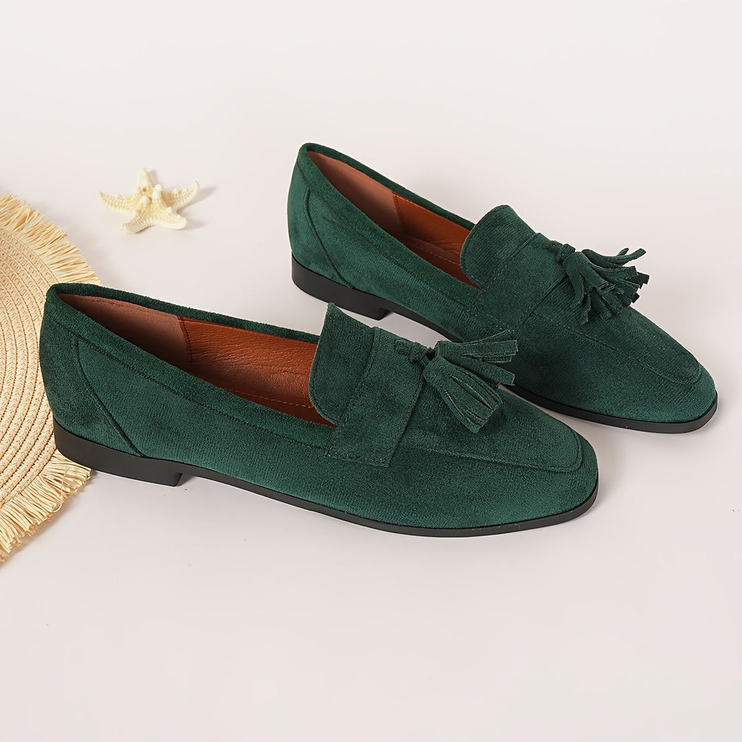 Smart green tassel loafers, comfortable slip-on choice for women's office & everyday fashion.