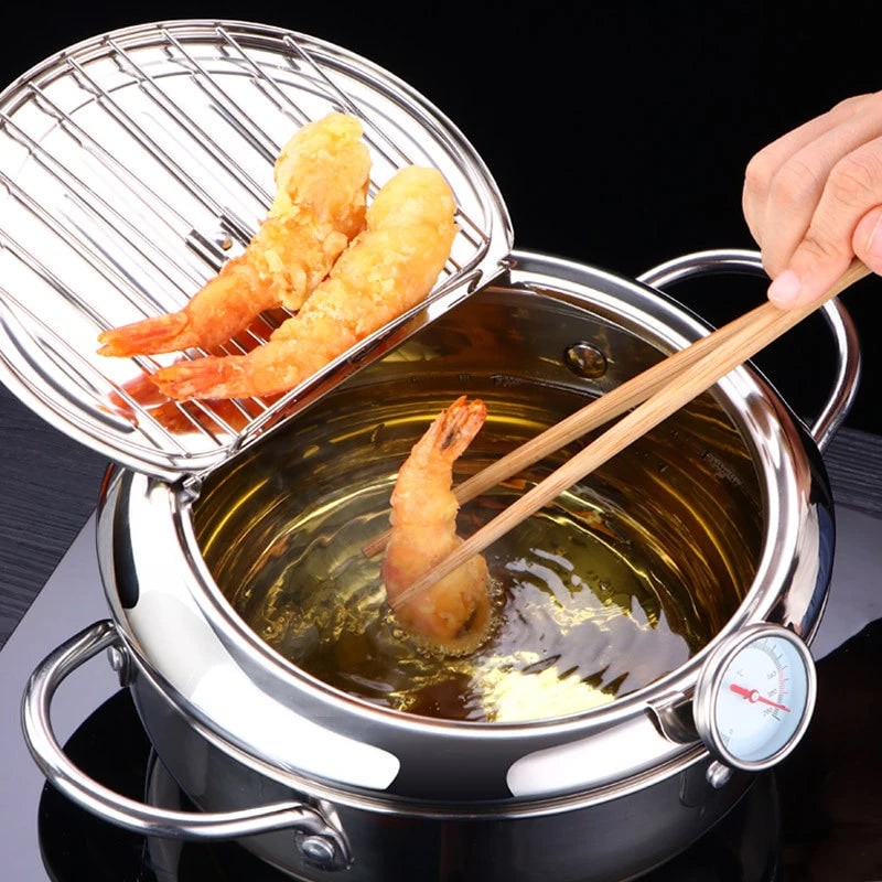 Smart deep fryer with accurate digital temperature control for perfect home cooking & crispy food. Stainless steel.