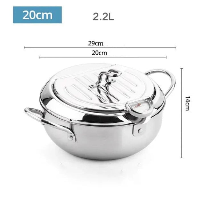 Stainless steel smart deep fryer cooking golden crispy tempura. Perfect for home frying with precise temperature control.