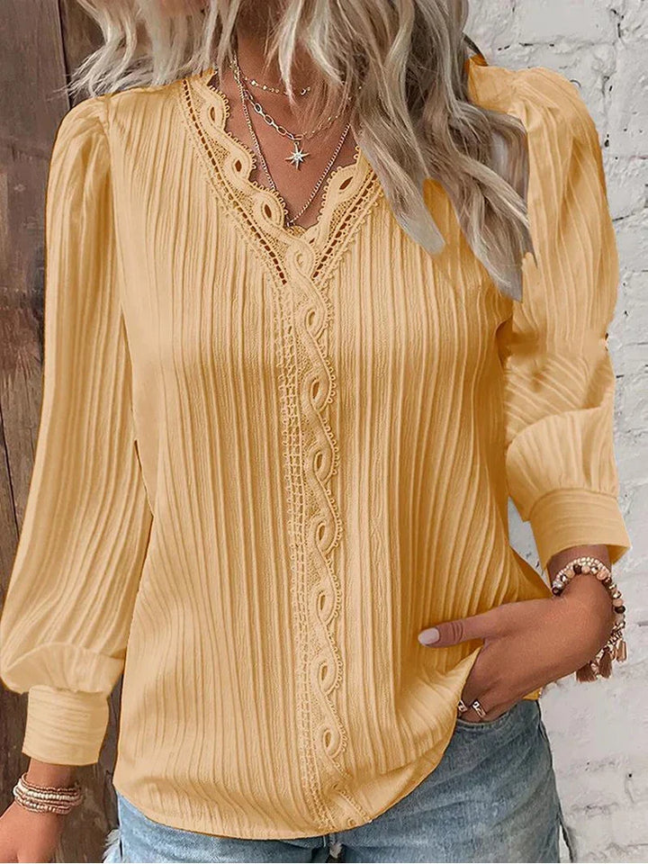 Elegant women's ribbed V-neck long sleeve top, providing comfort and style for fashionable daily wear.