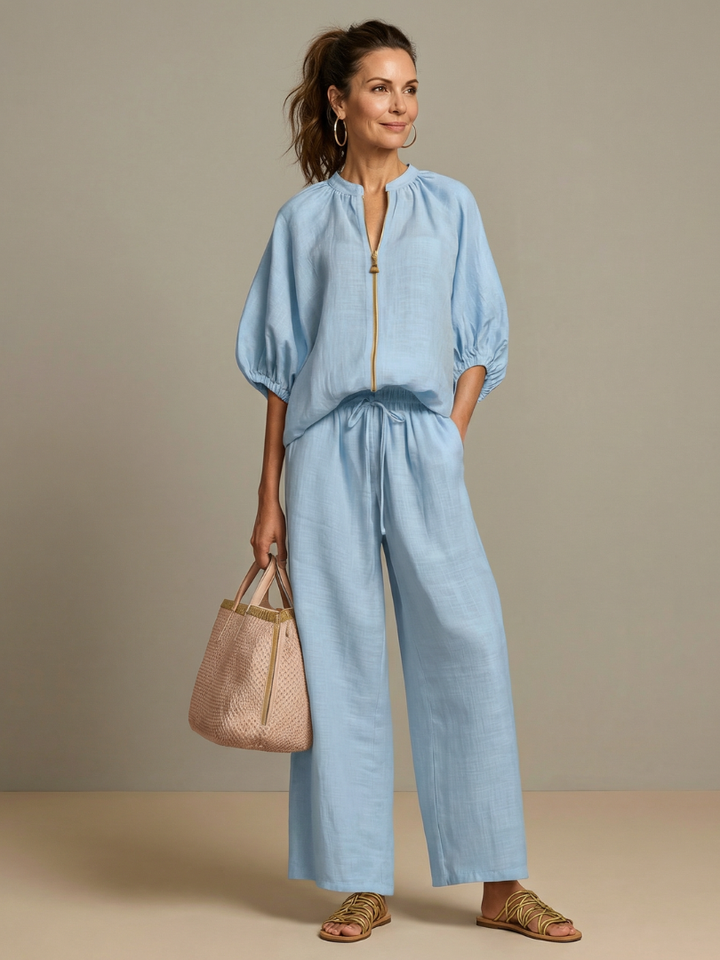 Women's co-ord set with stylish wide leg pants & zip-front top for casual chic look.
