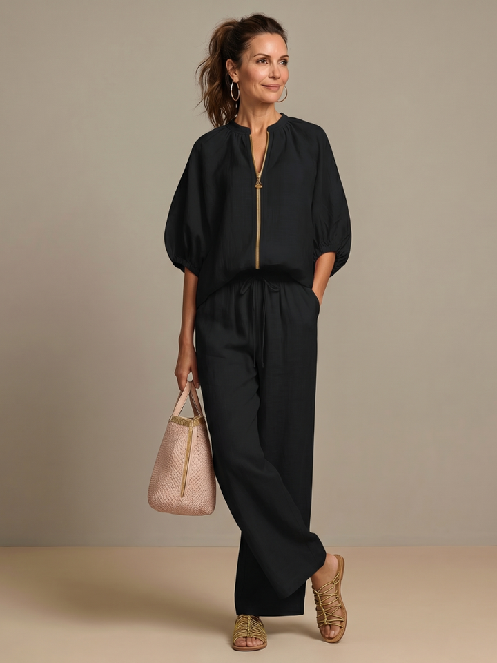 Comfortable women's co-ord set: wide leg pants and a zip-front top designed for effortless style.
