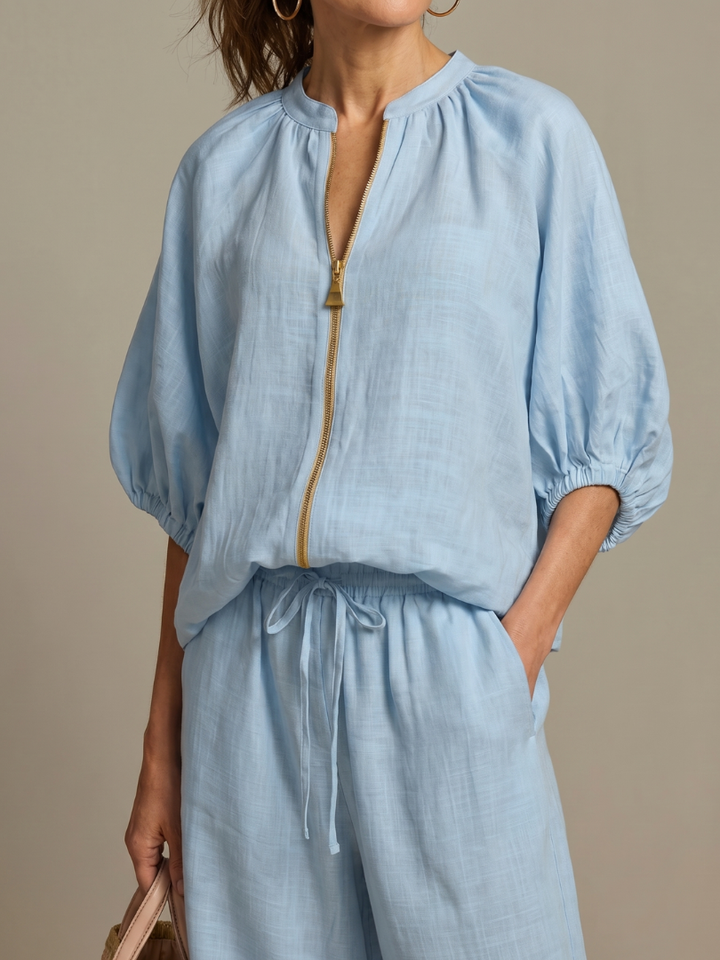 Summer fashion: Versatile women's co-ord with flowy wide leg pants & modern zip-front top.