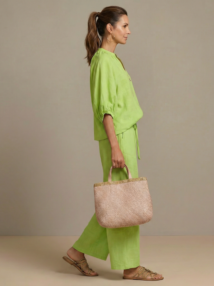 Chic women's ensemble: wide leg pants paired with a stylish zip-front top for ultimate comfort.