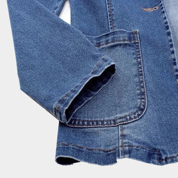 Versatile women's blue denim blazer, a chic jacket for casual or smart casual outfits. Denim fashion.