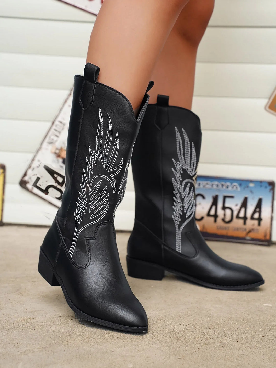 Unique flame pattern detail on women's pointed toe Western cowboy boots.