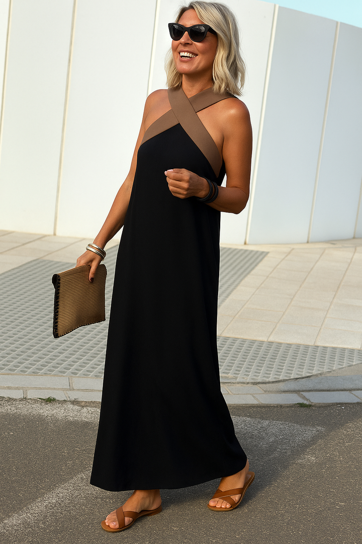 Women's elegant crossover halter maxi dress with a flattering silhouette, ideal for summer occasions.