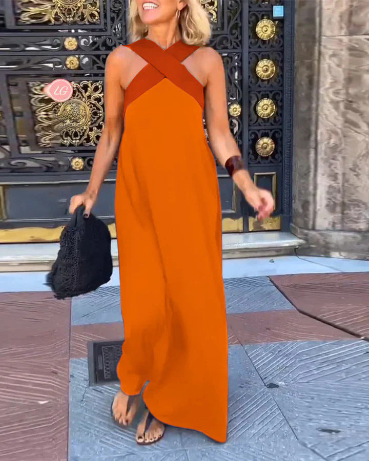 Stylish women's two-tone crossover halter maxi dress, offering elegant summer comfort.