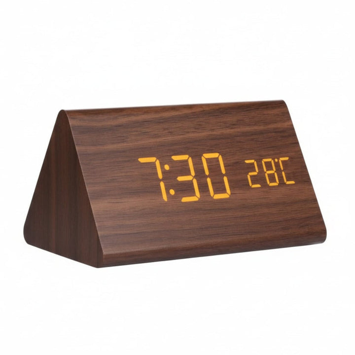Multi-function digital alarm clock displaying time, date, and temperature on a clear LED.