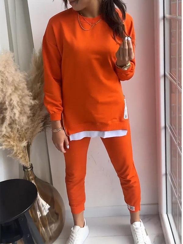 Stylish women's relaxed fit tracksuit, perfect for casual wear & everyday style.
