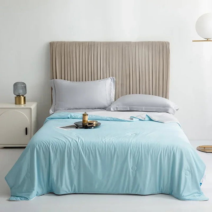 Double-sided cooling blanket for hot sleepers, offering refreshing comfort & lightweight breathability.