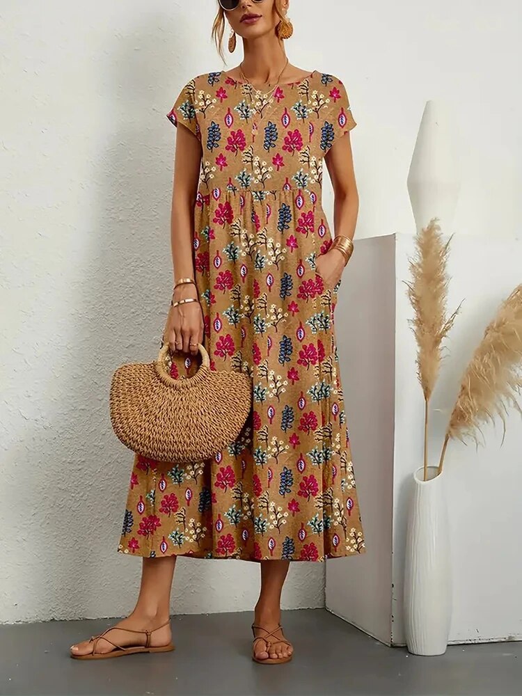 Women's printed maxi dress with round neck, perfect for casual summer wear. Comfortable & flowy A-line style.