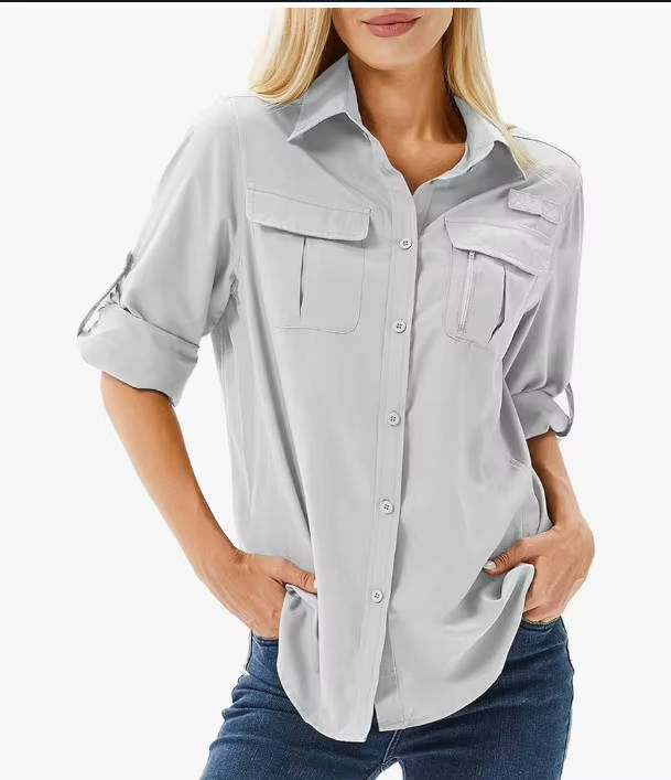 Close-up of breathable fabric on women's UPF 50 long sleeve hiking shirt for active sun protection.