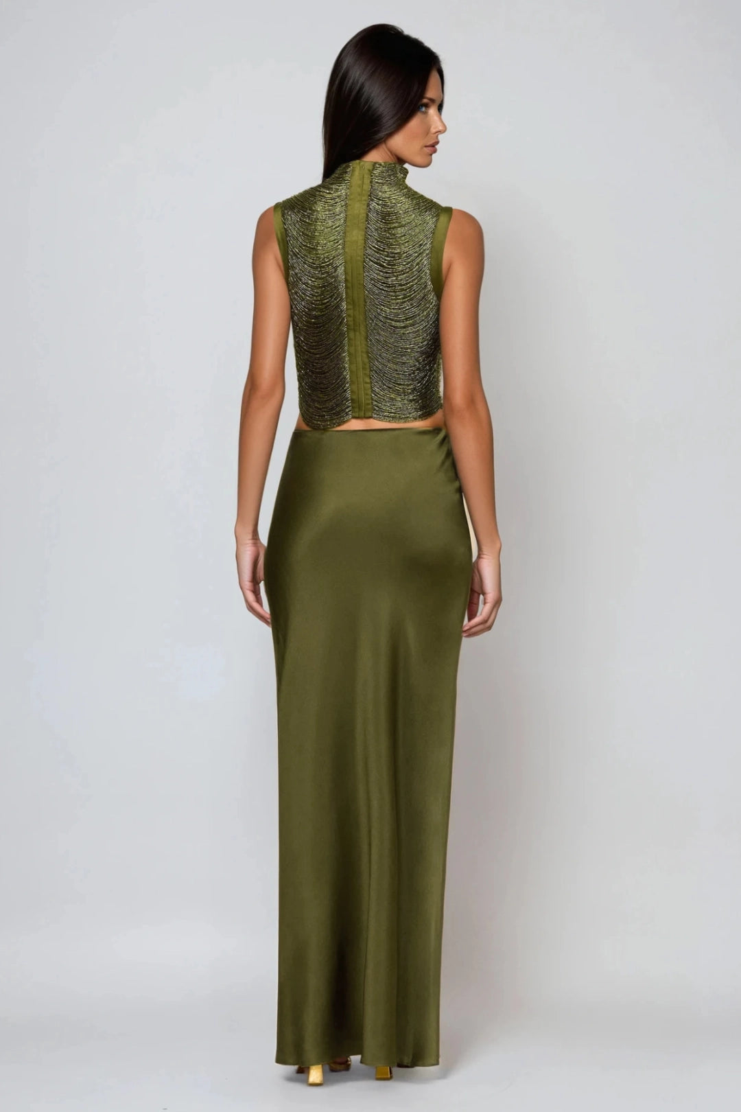 Sophisticated women's olive green two-piece set: sleeveless draped high neck top and elegant maxi skirt for special occasions.