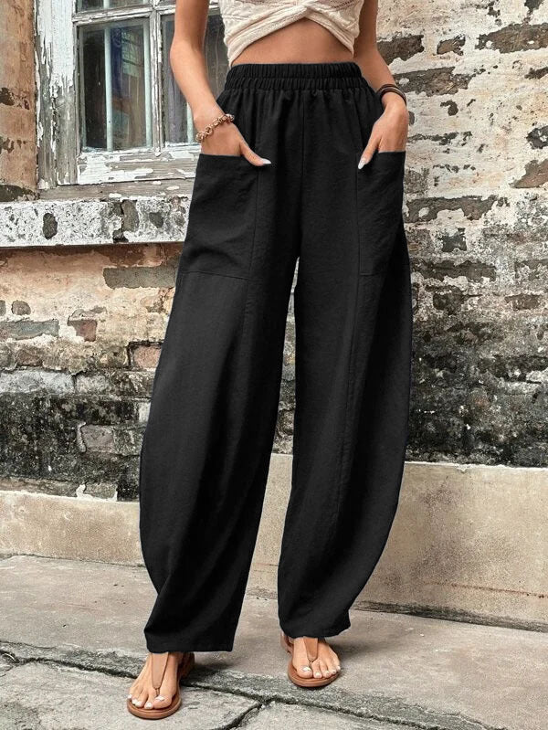 Women's comfortable wide-leg palazzo trousers with pockets, great for travel or day-to-day fashion.