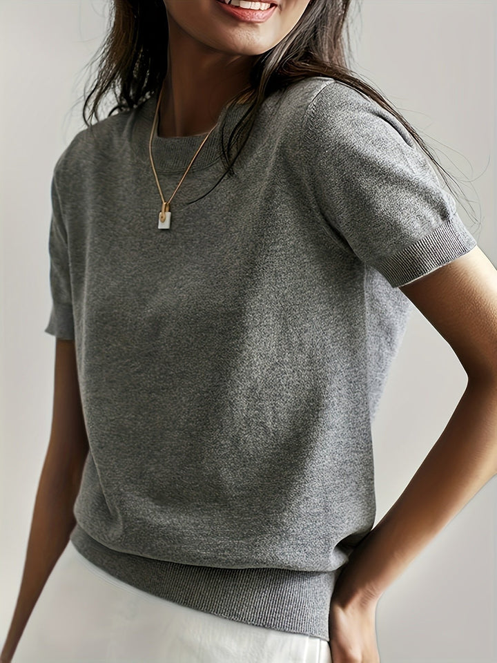 Chic women's short-sleeve top, perfect for layering or everyday comfort. Features a classic round neck.
