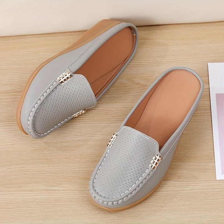 Comfortable women's wedge mules, a chic slip-on sandal design for versatile everyday style.