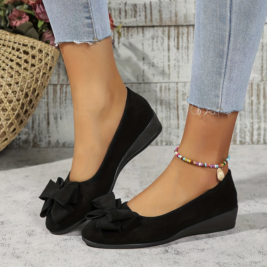 Navy suede women's wedge flats, versatile slip-on shoes with cute bow for everyday comfort.