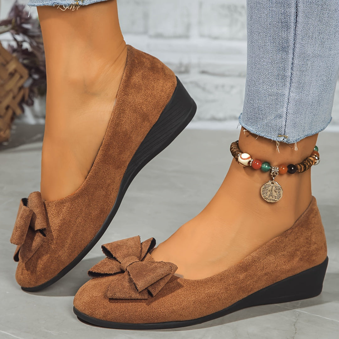 Grey women's wedge ballet flats, comfortable everyday slip-on shoes with a neat bow detail.
