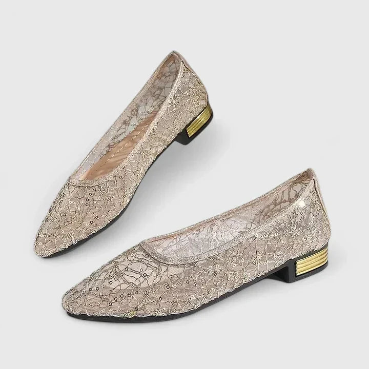 Elegant women's pointed-toe flats featuring a sleek design and stylish gold heel detail. Perfect for formal wear.