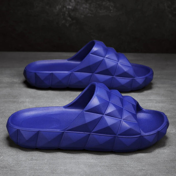 Chic men's slides featuring a unique geometric textured pattern.