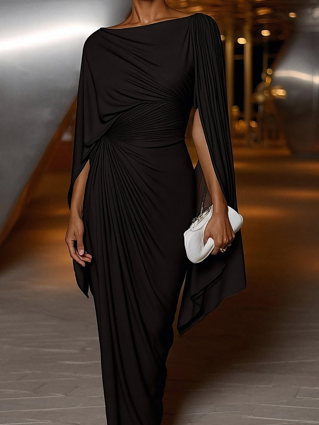 Stunning women's evening gown features elegant cape sleeves and a flattering maxi length, ideal for formal black tie events.