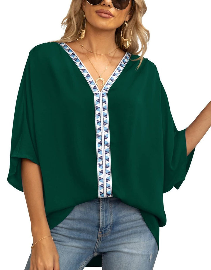 Casual yet chic women's boho tunic with embroidered V-neck & oversized fit. Versatile summer top.