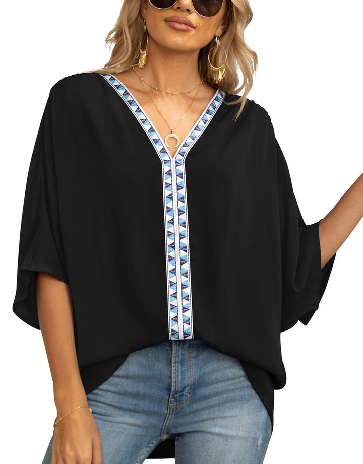 Stylish women's V-neck tunic, featuring intricate boho embroidery and an oversized, comfortable fit.