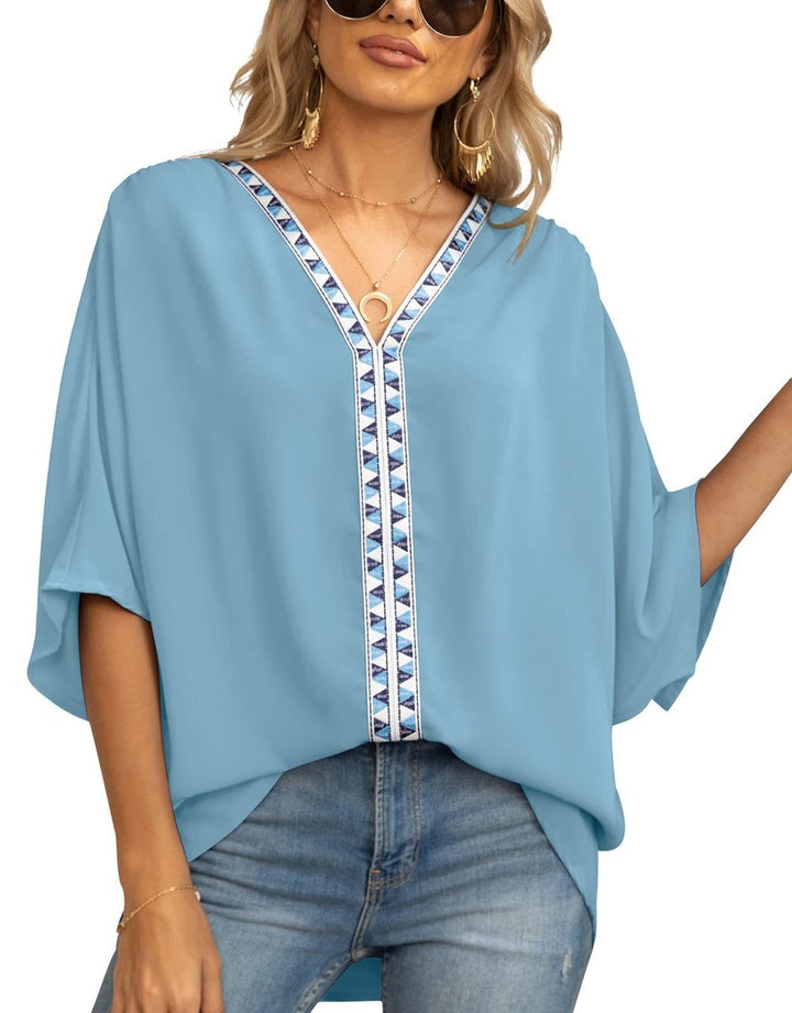 Elegant women's boho embroidered tunic, oversized V-neck design for a chic, relaxed look.