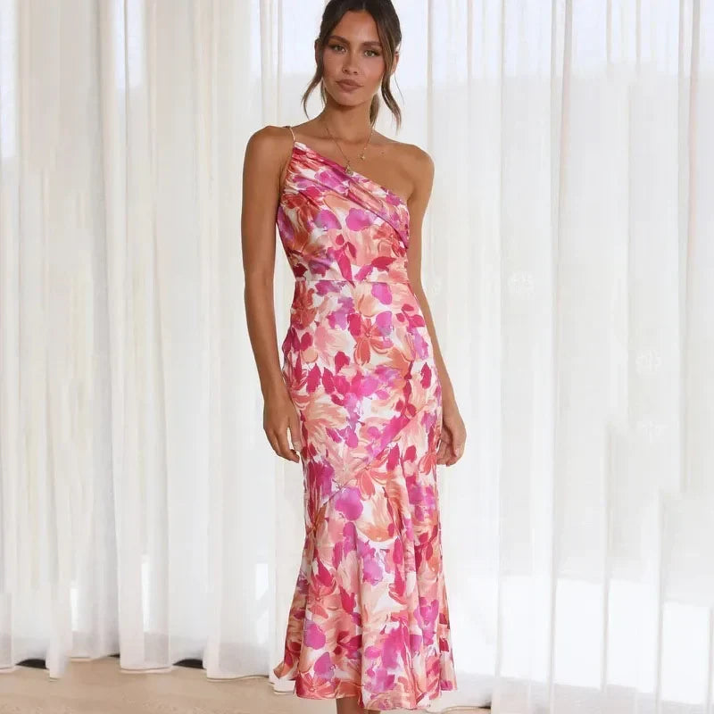 Elegant women's asymmetrical one-shoulder midi dress with vibrant floral print, perfect for summer parties.