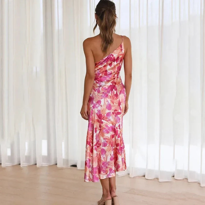 Stylish women's asymmetrical floral midi dress. This elegant one-shoulder design is perfect for summer events.