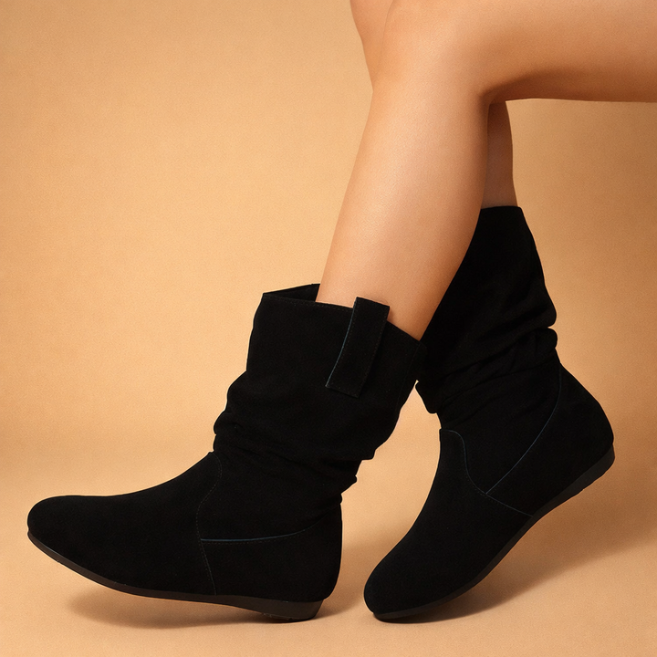 Women's black slouch ankle boots, pull-on style with flat sole for comfortable, casual everyday wear.